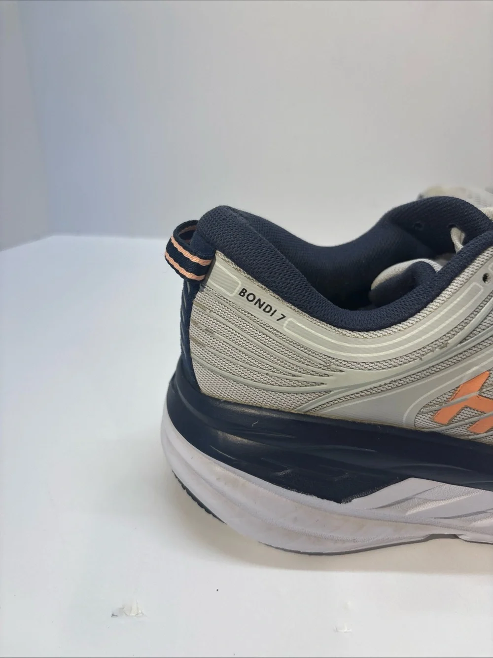 Hoka women’s size 7 gray/peach Bindi 7 style #110531 LRBI in fair condition.